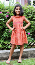 Load image into Gallery viewer, Kids Smocked dress with lining - orange/magenta floral

